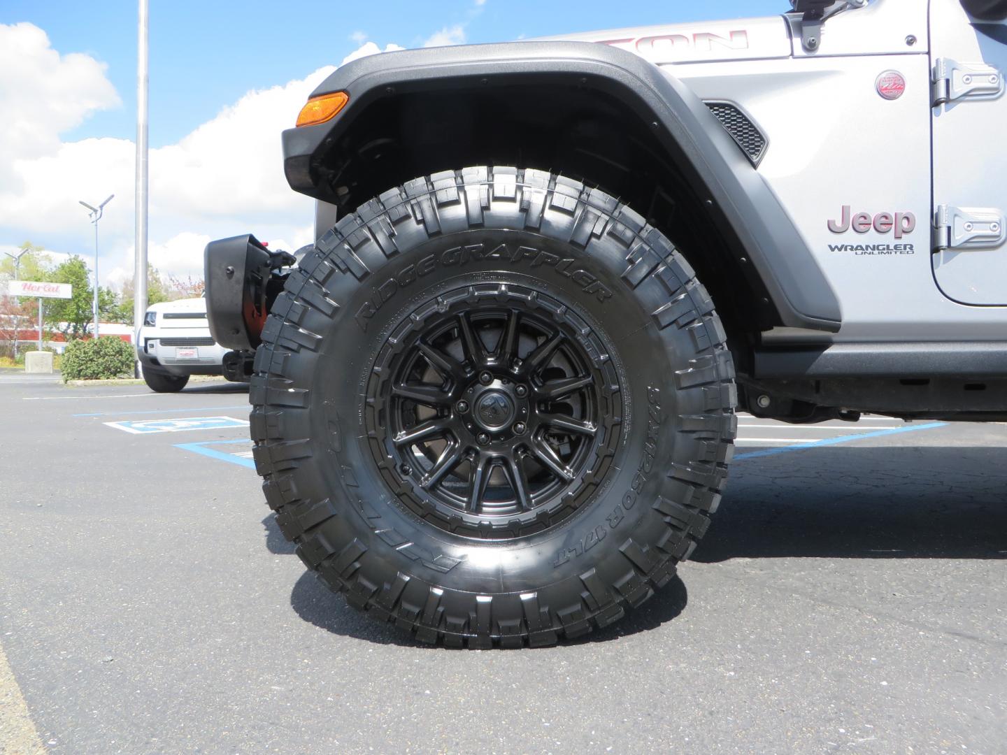 2021 SILVER /BLACK Jeep Wrangler Unlimited Rubicon (1C4HJXFG7MW) with an 3.6L V6 DOHC 24V FFV engine, 6A transmission, located at 2630 Grass Valley Highway, Auburn, CA, 95603, (530) 508-5100, 38.937893, -121.095482 - Features - Zone Offroad 3" Lift kit, Fox shocks, 37" Nitto Ridge Grappler tires, 17" Fuel Piston wheels, Warn winch, KC led lights, Voswitch switches, Teraflex HD tire relocation, Fire extinguisher, High Lift Jack, Shovel, Axe, Jumper Cables, and flat towable. - Photo#8